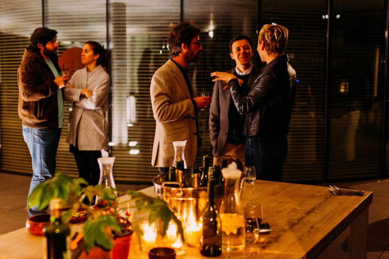 Networking Event - five person standing while talking each other