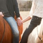 Healing Horse - man and woman riding horses while holding hands during day