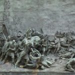 Battle Horse - gray concrete statue on gray concrete floor