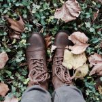 Riding Boots - person standing on green grass
