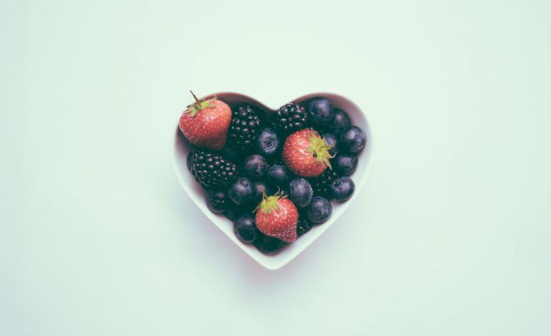 Aging Nutrition - heart-shaped bowl with strawberries