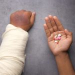 Arthritis Care - person holding babys hand