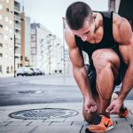 Nutrition Fitness - man tying his shoes