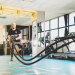 Cross-training - man in black and white crew neck t-shirt sitting on black wheelchair