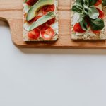 Snacking Health - slice avocado and tomatoes on tray